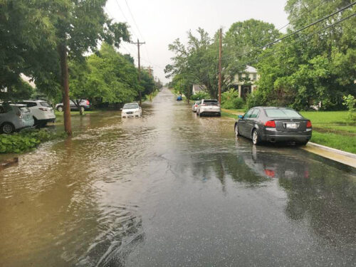 street with cars and flooding